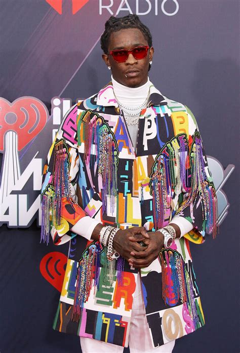 young thug wearing blackface gucci sweater|What Is the Mysterious Item Under Young Thug's Sweater in .